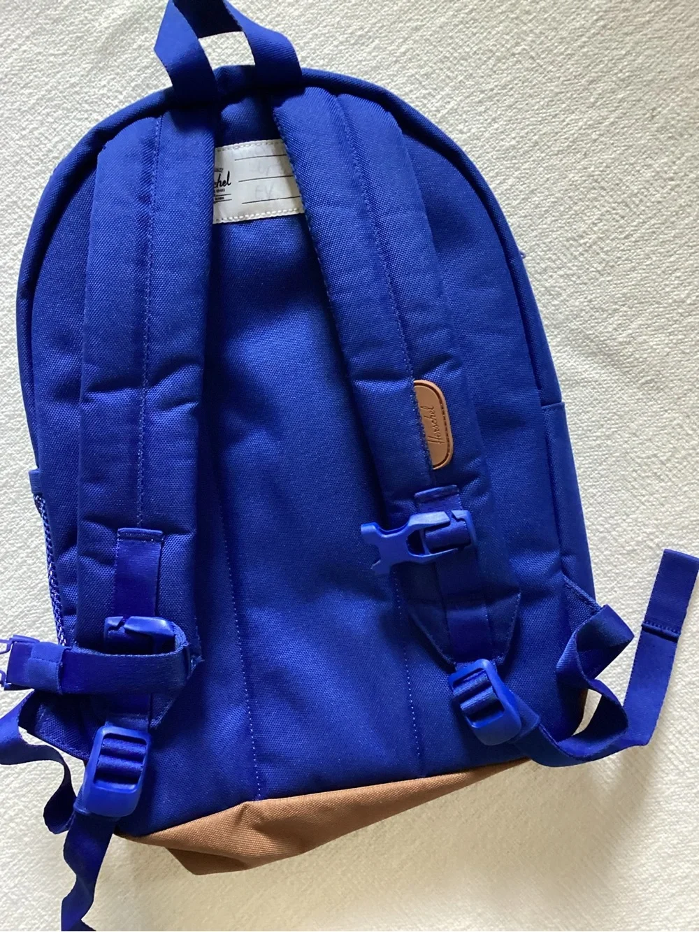 Herschel Supply Co. Heritage youth backpack in a blue and brown colorway.